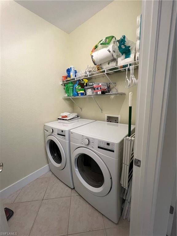 6809 Ascot Drive, Unit 201 Naples, FL 34113 - Photo 25 of 37 a utility room with dryer and washer