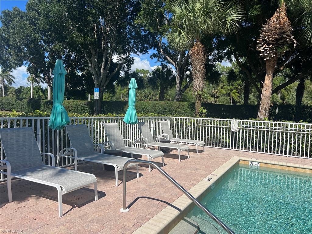6809 Ascot Drive, Unit 201 Naples, FL 34113 - Photo 28 of 37 a view of a patio with a bench
