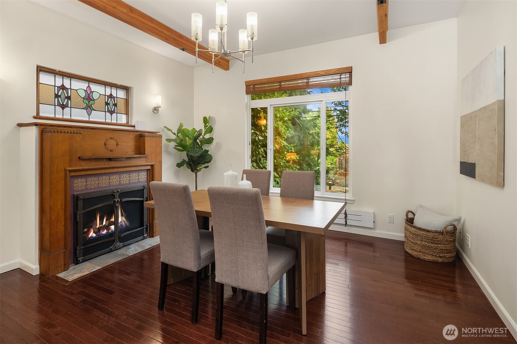 1629 22nd Avenue Seattle, WA 98122 - Photo 12 of 38 a dining room with furniture a fireplace and wooden floor