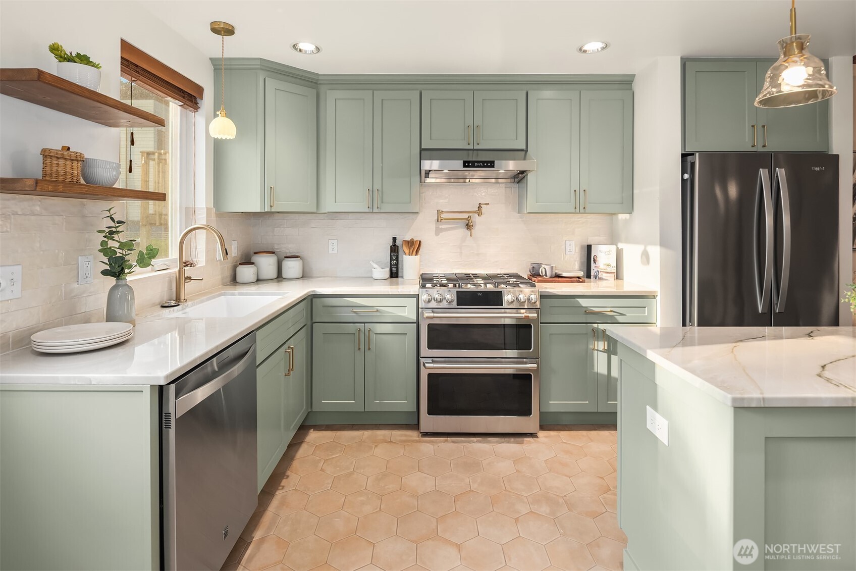 1629 22nd Avenue Seattle, WA 98122 - Photo 16 of 38 a kitchen with a sink stove and refrigerator