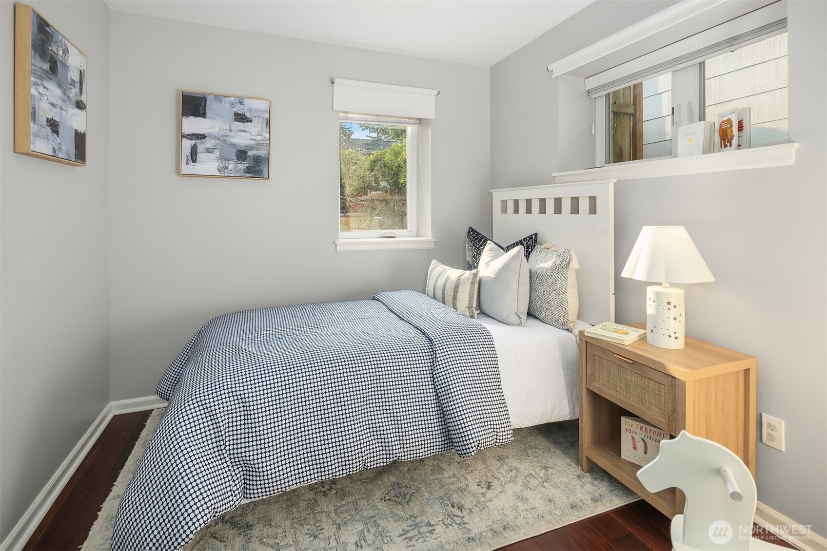 1629 22nd Avenue Seattle, WA 98122 - Photo 27 of 38 a bedroom with a bed a lamp and a window
