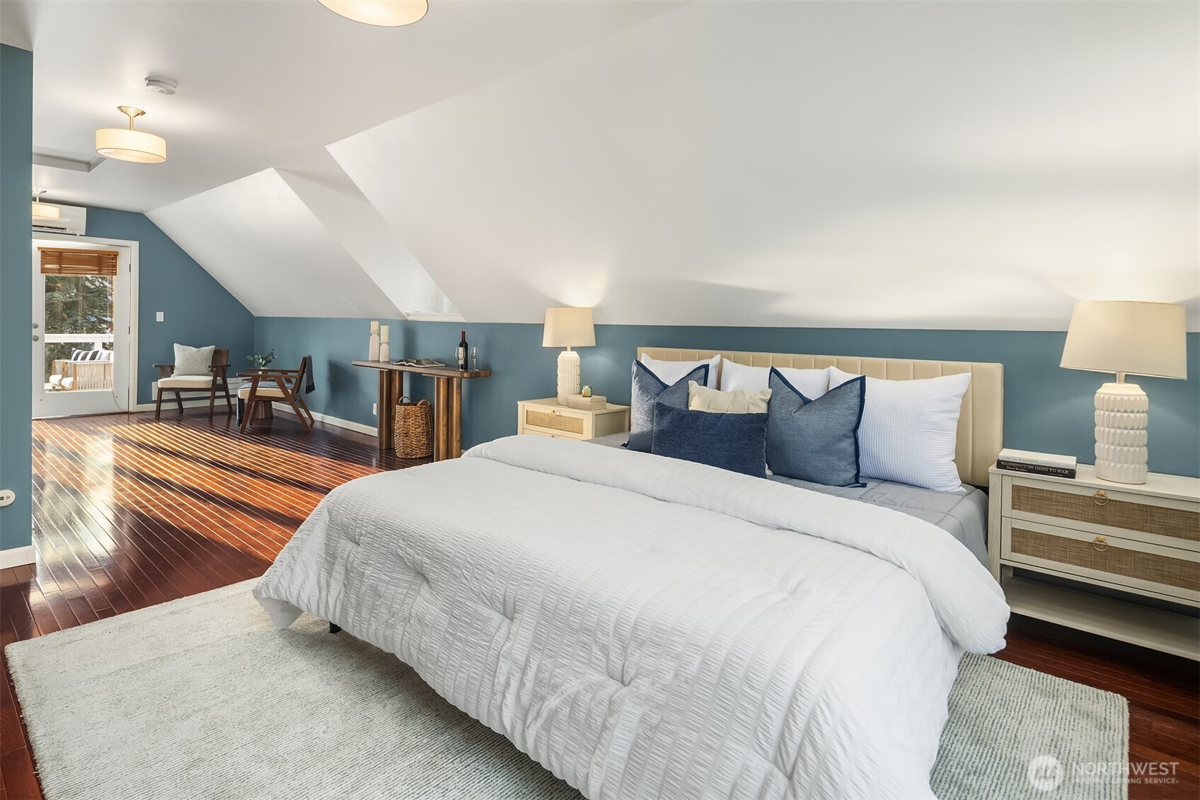 1629 22nd Avenue Seattle, WA 98122 - Photo 29 of 38 a large bed sitting in a bedroom and a table