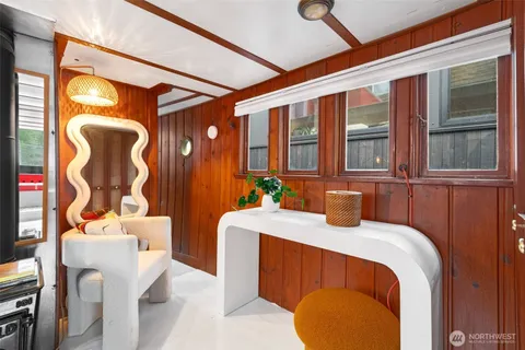 a bedroom with a bed and a table