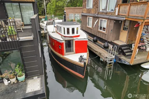 a balcony with table and chairs