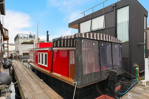 a view of a wooden chairs in a balcony