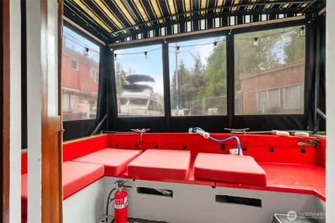 a room with pool table and windows