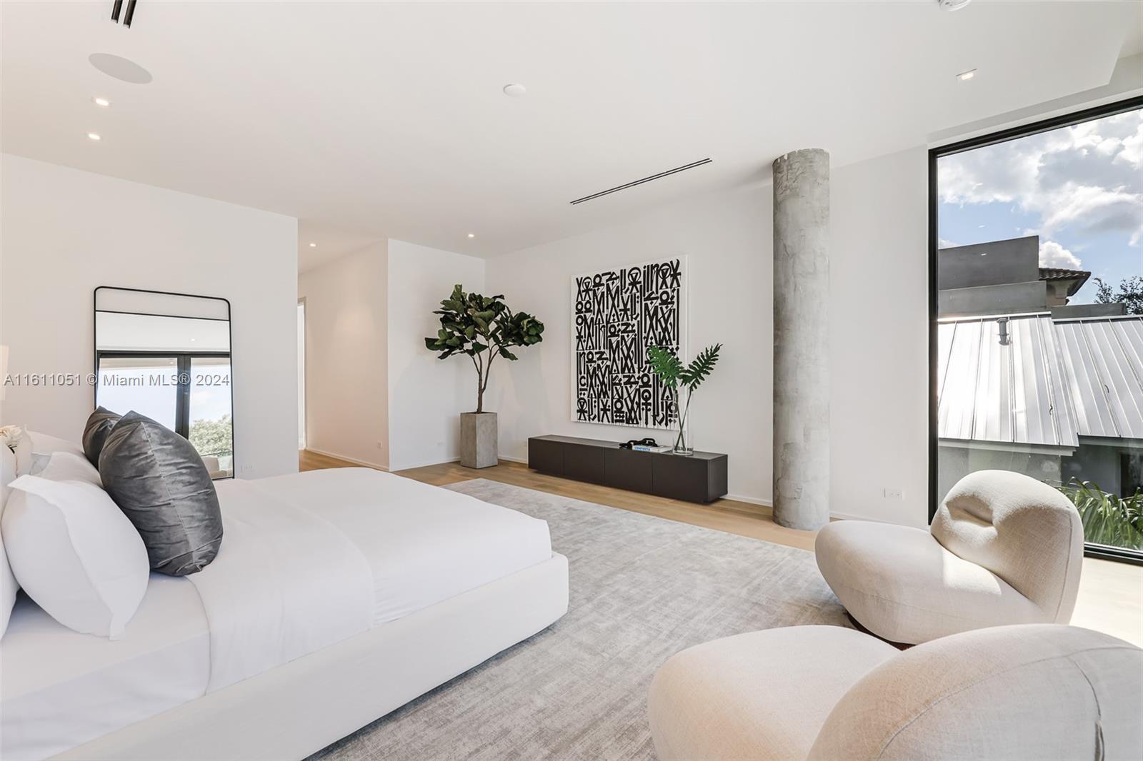 2832 Coconut Avenue, Unit 2832 Miami, FL 33133 - Photo 13 of 24 a bedroom with furniture and a large window