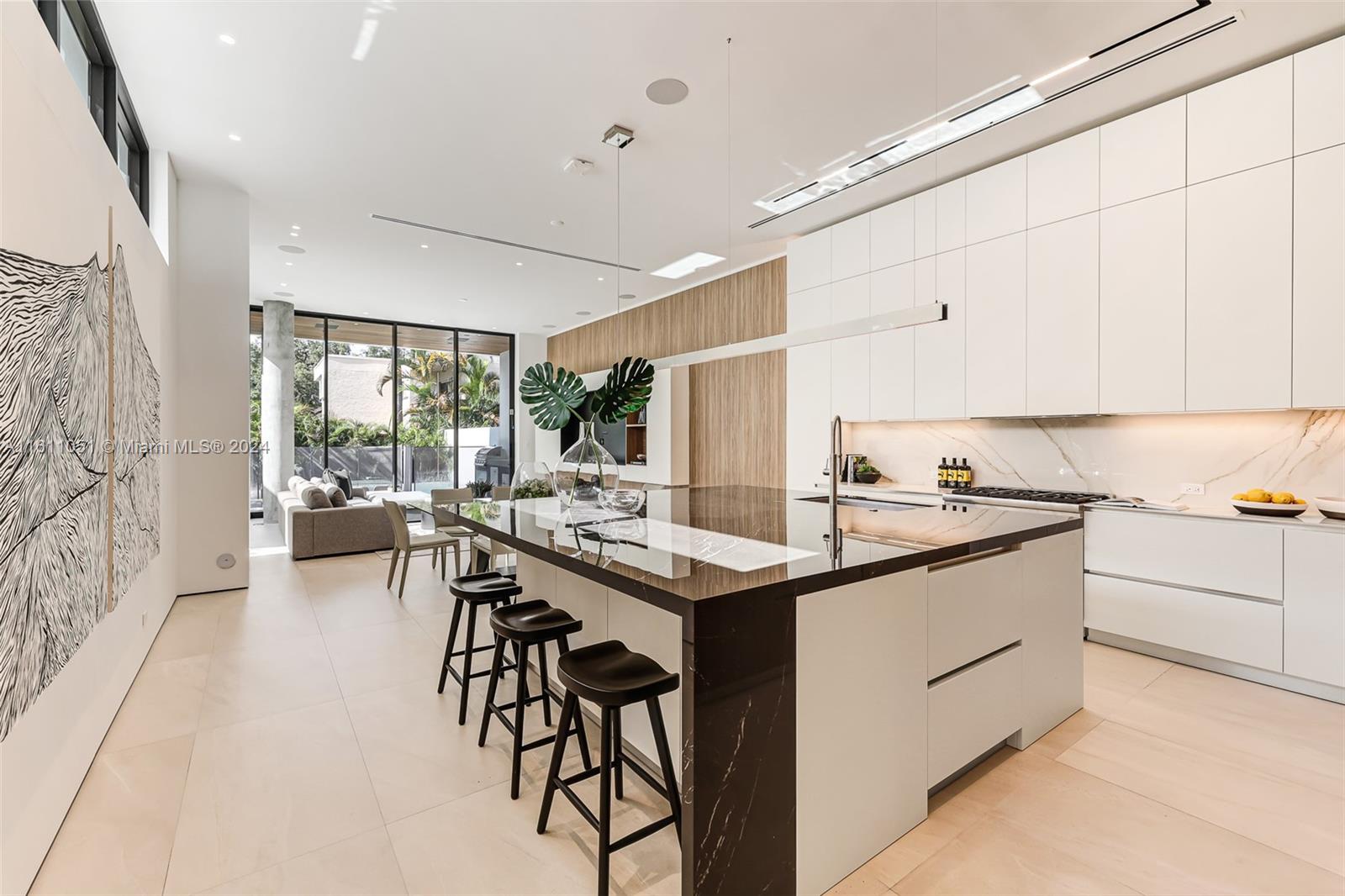 2832 Coconut Avenue, Unit 2832 Miami, FL 33133 - Photo 2 of 24 a kitchen with stainless steel appliances granite countertop a sink and cabinets