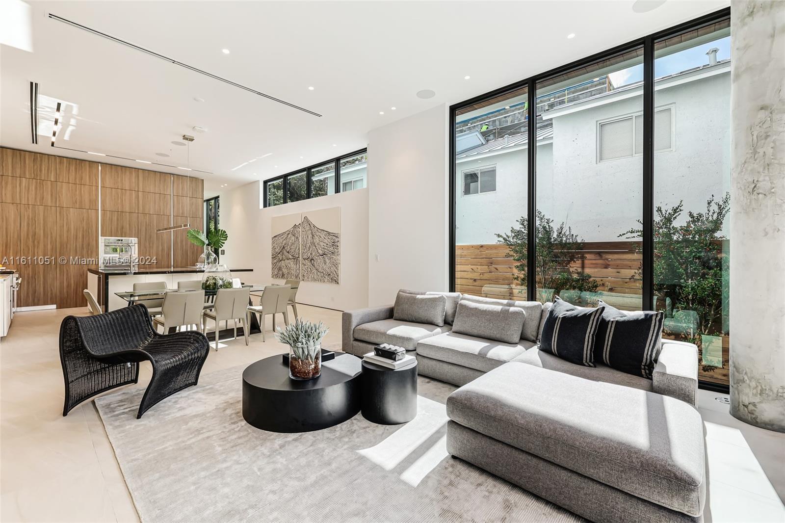 2832 Coconut Avenue, Unit 2832 Miami, FL 33133 - Photo 5 of 24 a living room with furniture and a large window