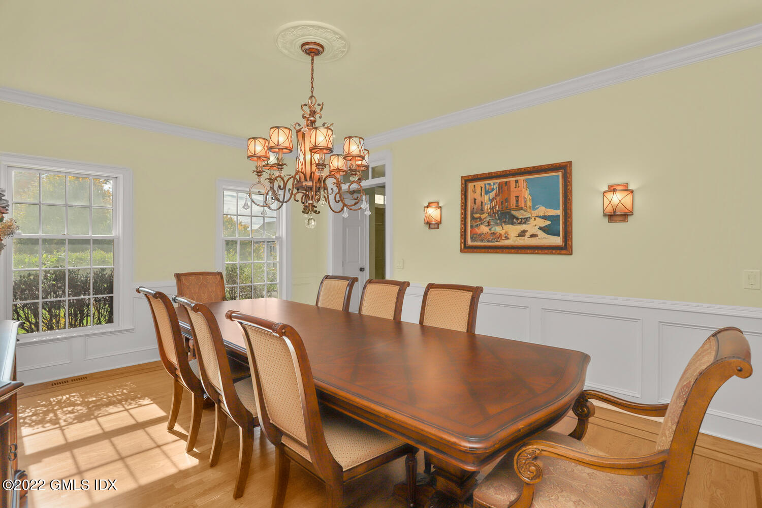 9 Robin Place Old Greenwich, CT 06870 - Photo 16 of 51 a view of a dining room with furniture a chandelier and wooden floor