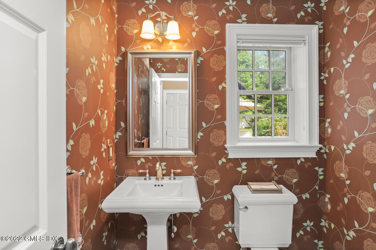 9 Robin Place Old Greenwich, CT 06870 - Photo 19 of 51 a bathroom with a toilet sink and mirror