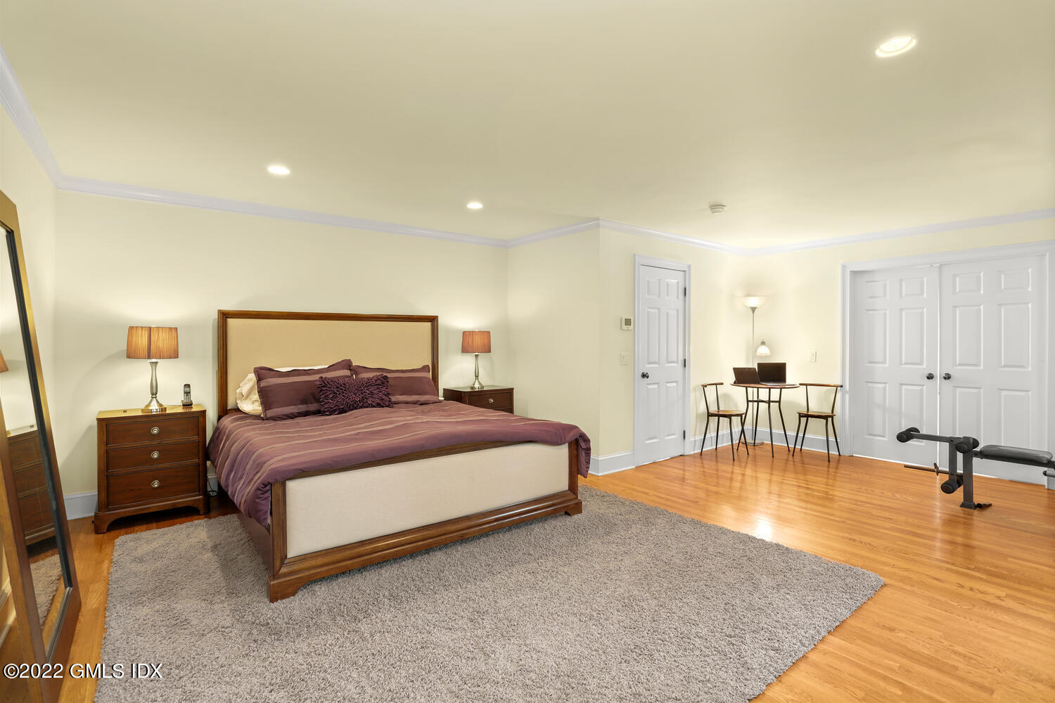 9 Robin Place Old Greenwich, CT 06870 - Photo 21 of 51 a bedroom with a bed a table and dresser