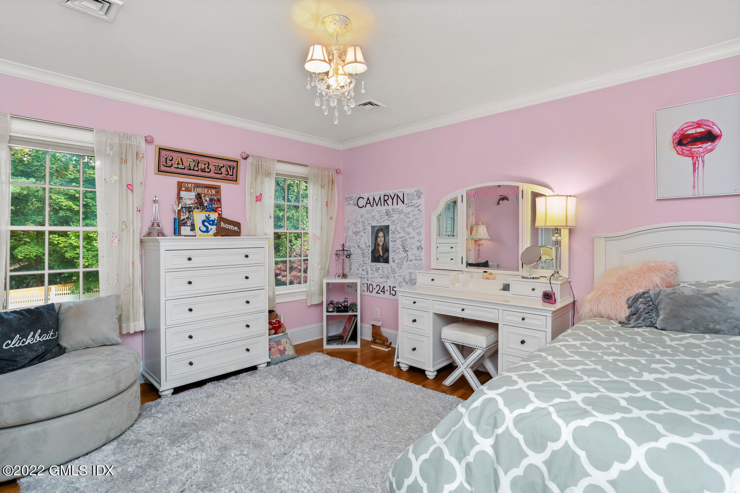 9 Robin Place Old Greenwich, CT 06870 - Photo 26 of 51 a bedroom with a bed and a chandelier