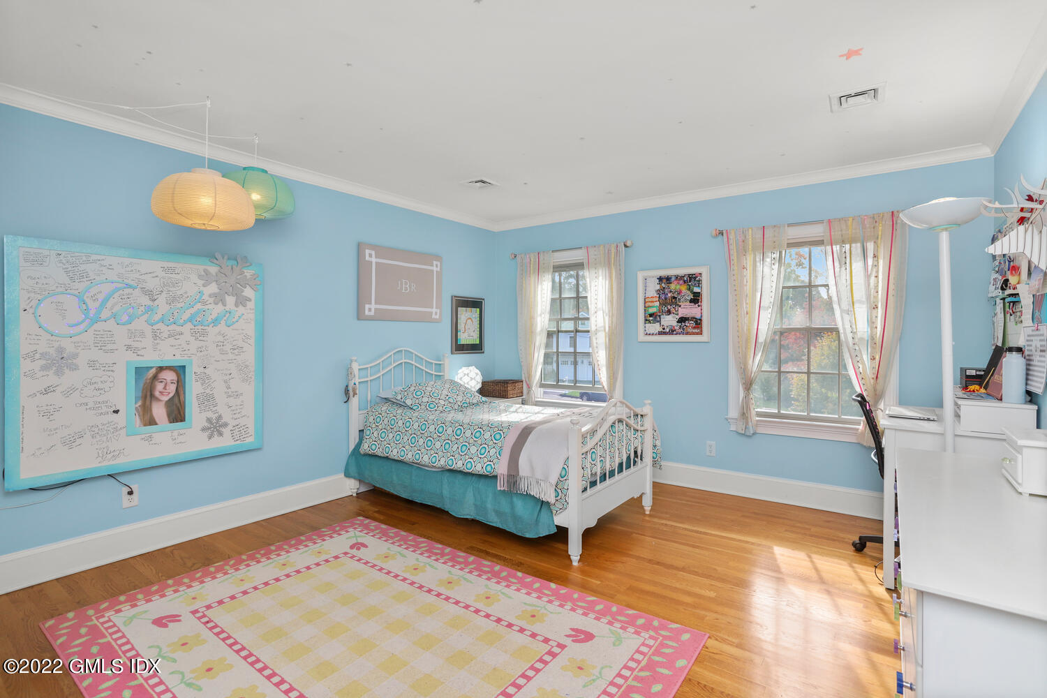 9 Robin Place Old Greenwich, CT 06870 - Photo 28 of 51 a bedroom with a bed and wooden floor