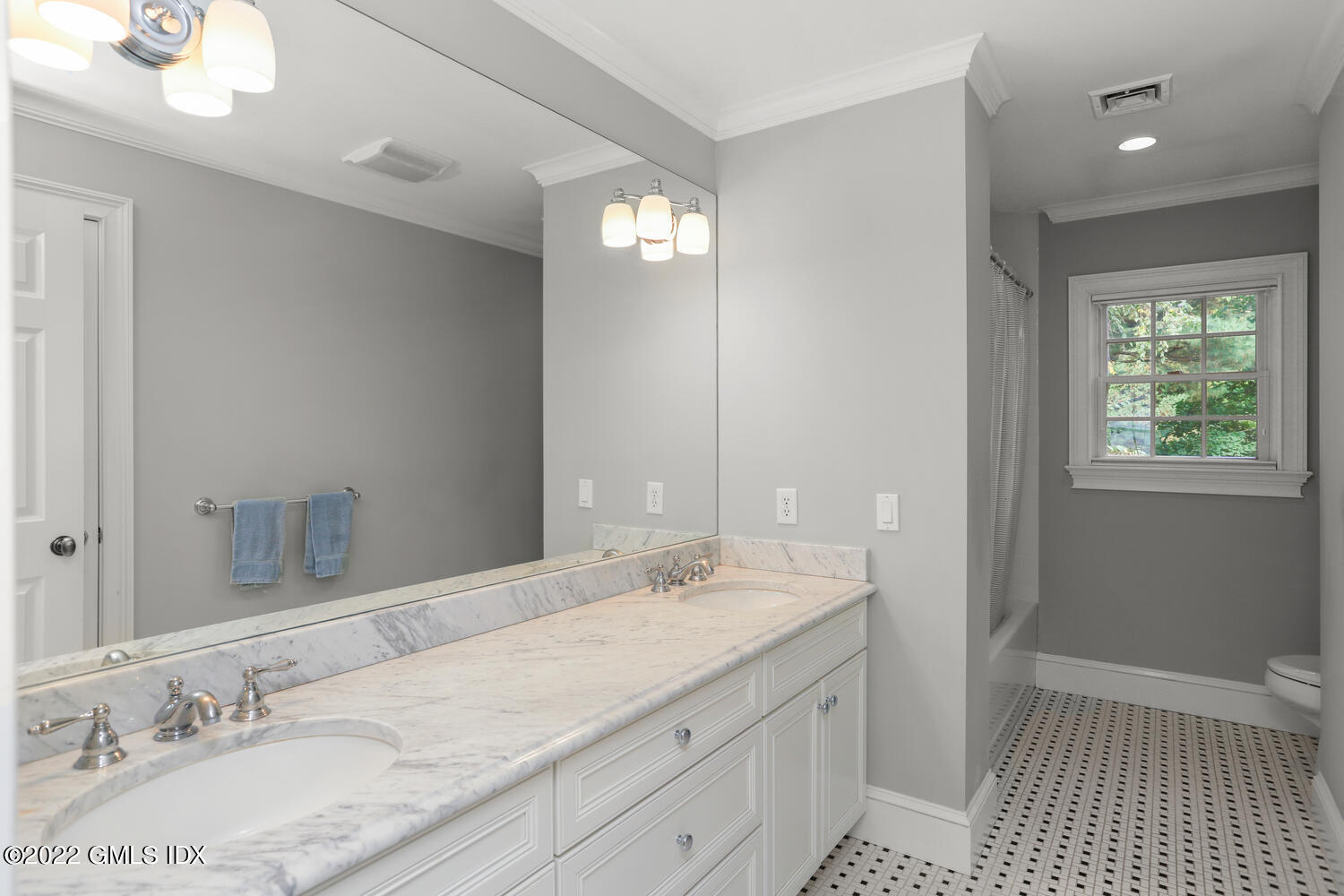 9 Robin Place Old Greenwich, CT 06870 - Photo 30 of 51 a bathroom with a granite countertop double vanity sink a mirror and a shower