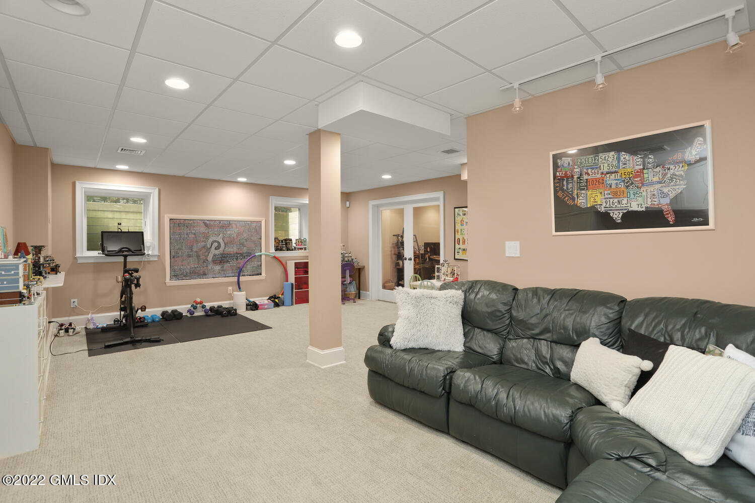 9 Robin Place Old Greenwich, CT 06870 - Photo 36 of 51 a living room with furniture and a large window