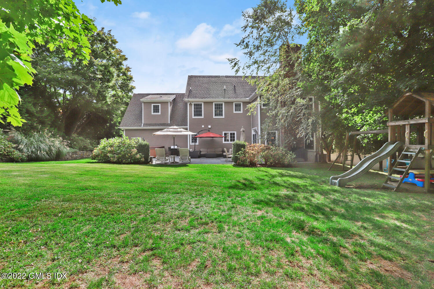 9 Robin Place Old Greenwich, CT 06870 - Photo 45 of 51 a front view of a house with garden