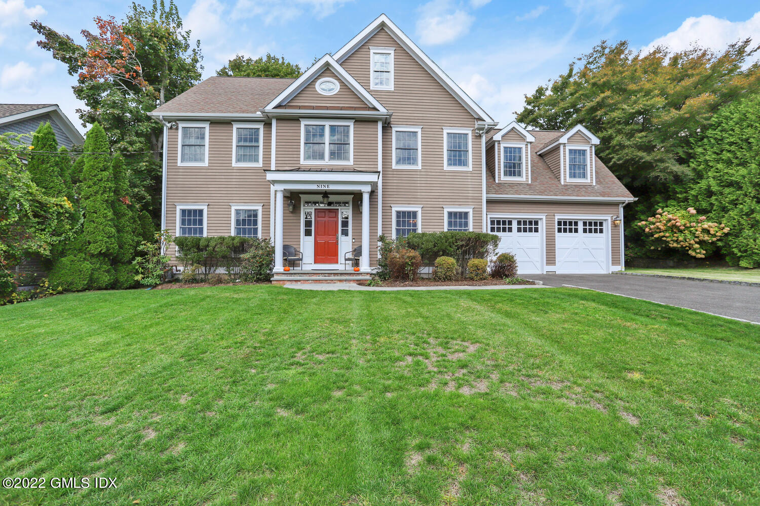 9 Robin Place Old Greenwich, CT 06870 - Photo 46 of 51 a front view of a house with a yard
