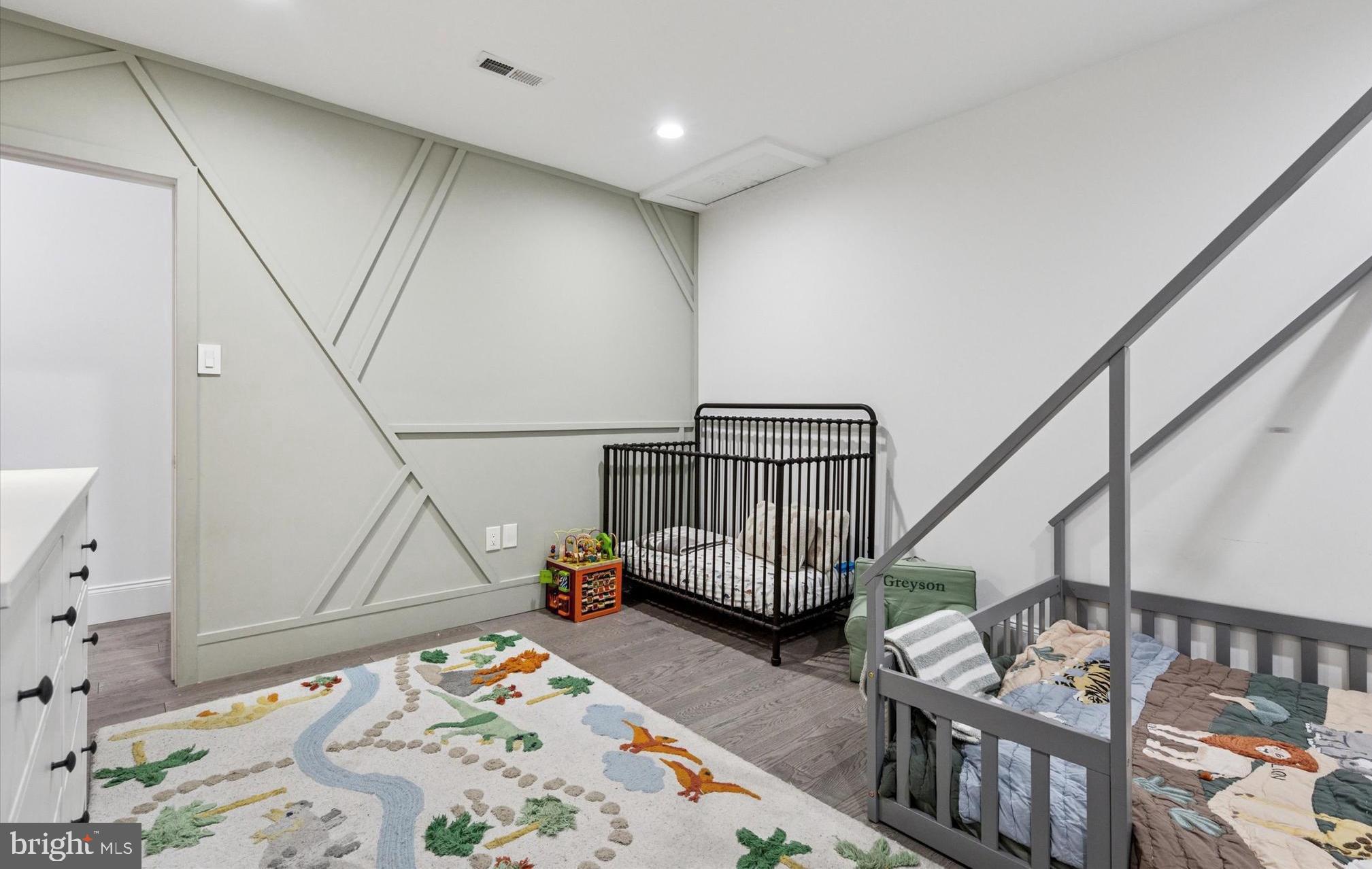 2694 Bridge Street Philadelphia, PA 19137 - Photo 23 of 41 a bedroom with furniture and a wooden floor