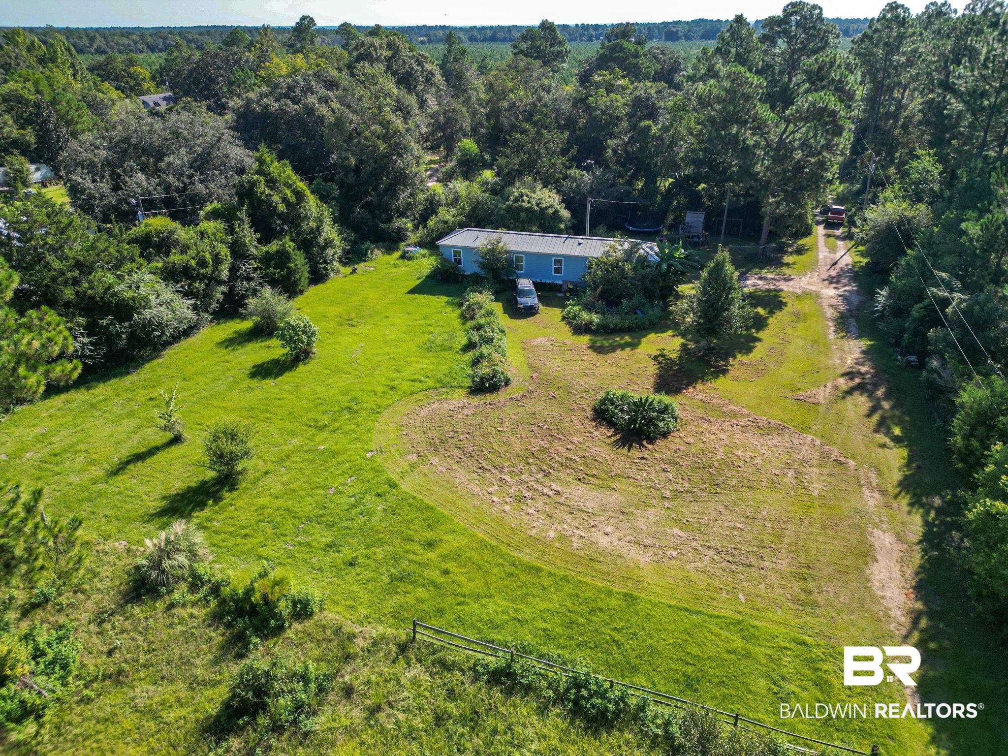 32465 Jay Kee Lane Elberta, AL 36530 - Photo 5 of 17 Aerial view of sparsely populated area featuring a heavily wooded area