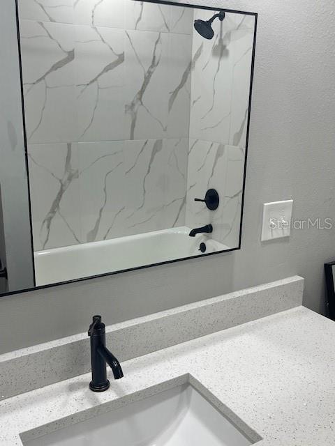 12149 Armenia Gables Circle, Unit 12149 Tampa, FL 33612 - Photo 15 of 27 a bathroom with a bathtub