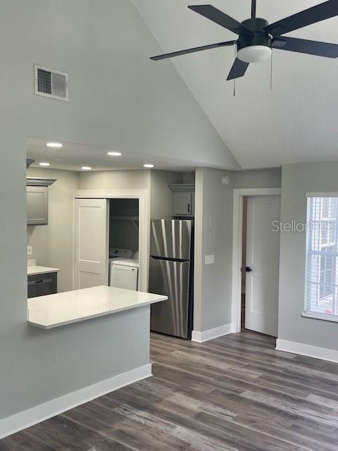 12149 Armenia Gables Circle, Unit 12149 Tampa, FL 33612 - Photo 24 of 27 a large white kitchen with a large window appliances and cabinets