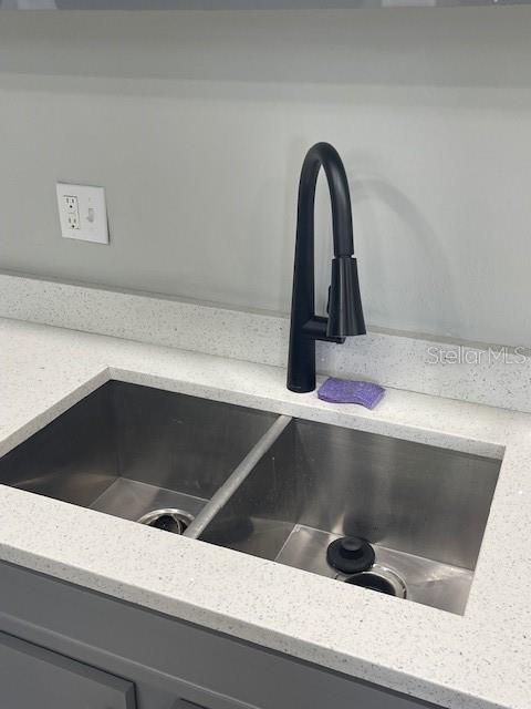 12149 Armenia Gables Circle, Unit 12149 Tampa, FL 33612 - Photo 5 of 27 a close view of sink and tap