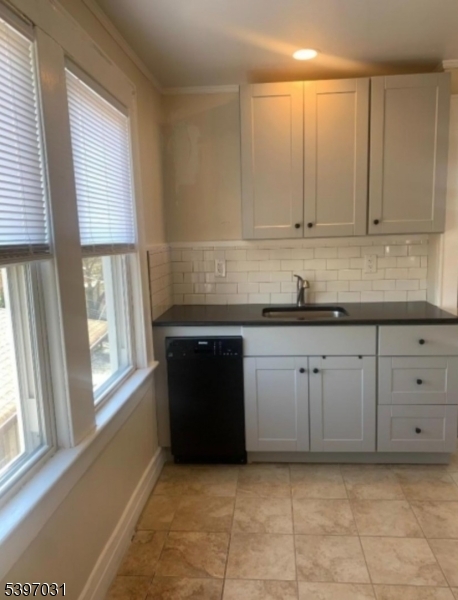 10 Hagert Street, Unit 3 Nutley, NJ 07110 - Photo 2 of 8 a kitchen with granite countertop a sink and a stove