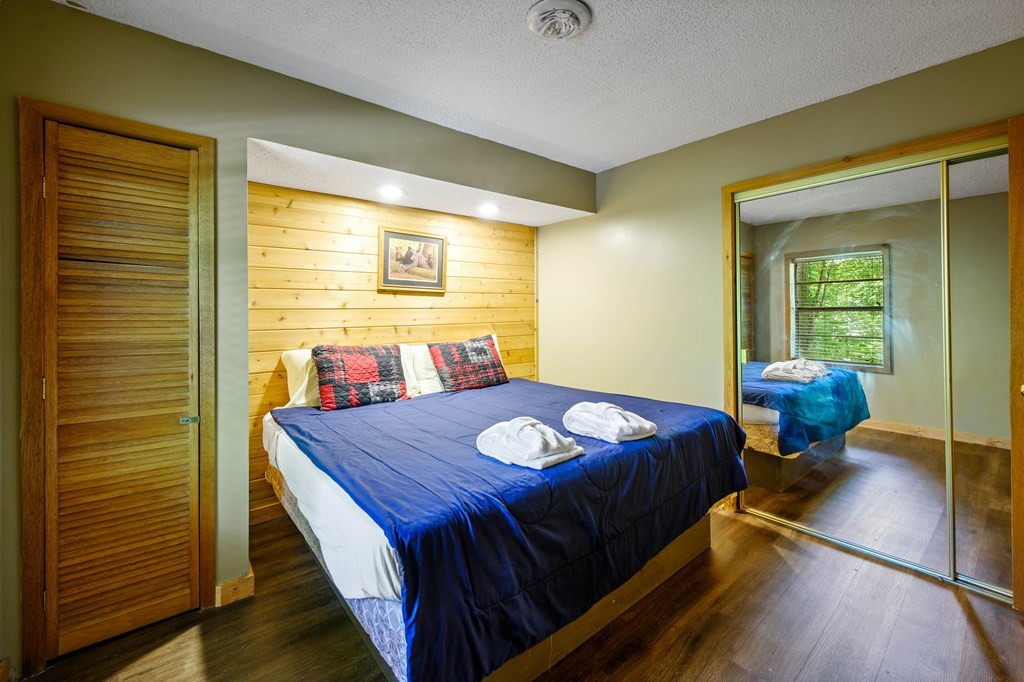 4296 Powdermill Estates Road Sevierville, TN 37876 - Photo 45 of 55 a bed sitting in a bedroom next to a window