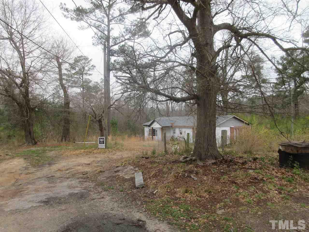 4921 Universal Drive Wake Forest, NC 27587 - Photo 13 of 15 a backyard of a house with lots of green space