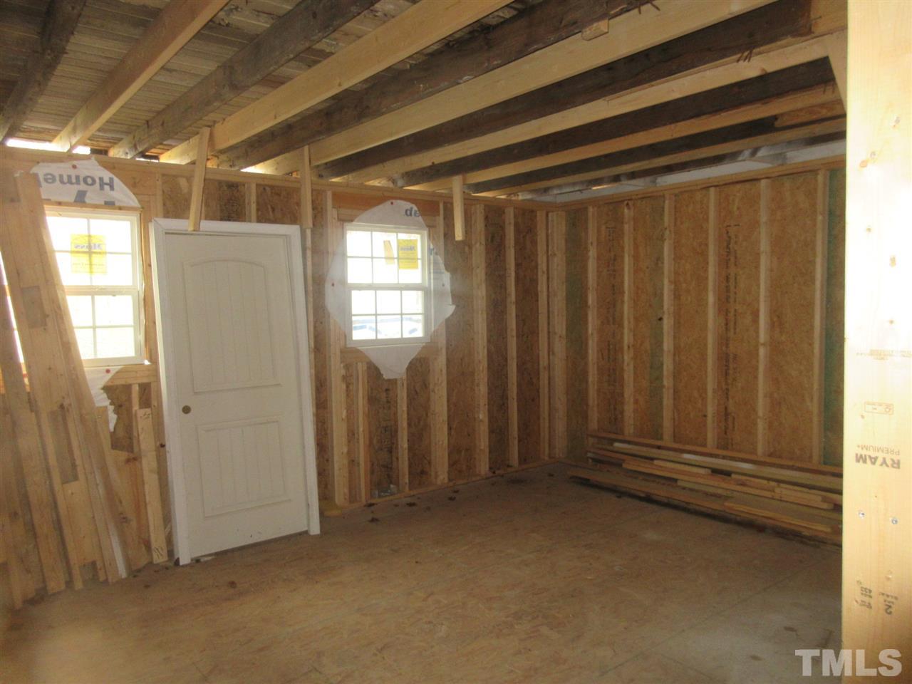 4921 Universal Drive Wake Forest, NC 27587 - Photo 7 of 15 a view of front door with yard and refrigerator
