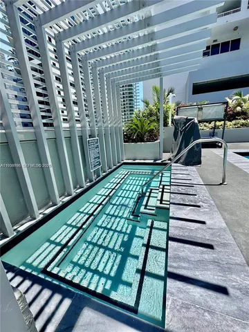 a view of a swimming pool with a patio