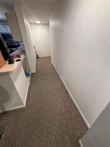 a view of a livingroom with wooden floor