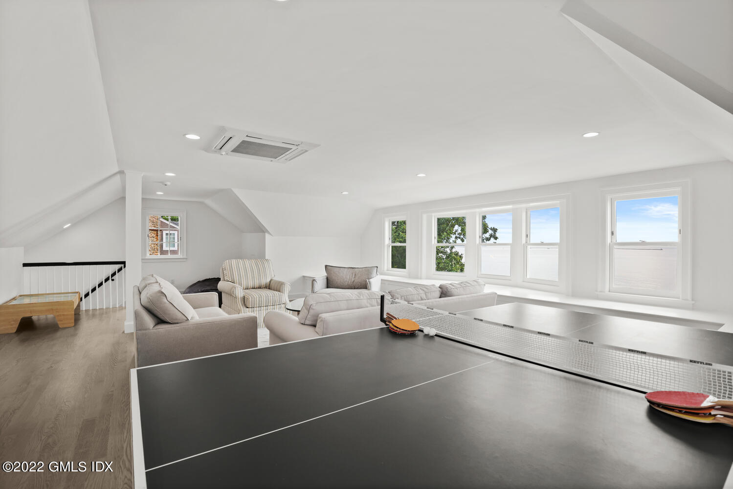 53 Shore Road Clinton, CT 06413 - Photo 11 of 32 a room with gym equipment and a large window