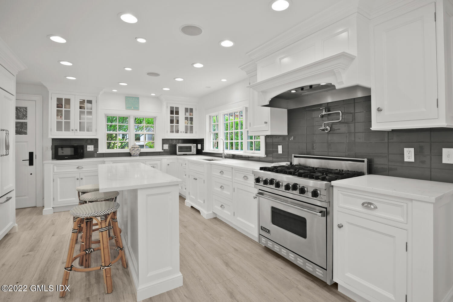 53 Shore Road Clinton, CT 06413 - Photo 12 of 32 a kitchen with stainless steel appliances granite countertop a stove a sink and a refrigerator