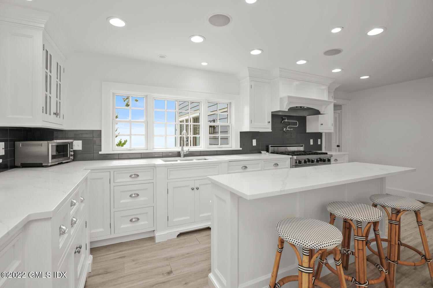 53 Shore Road Clinton, CT 06413 - Photo 13 of 32 a kitchen with sink a microwave and cabinets