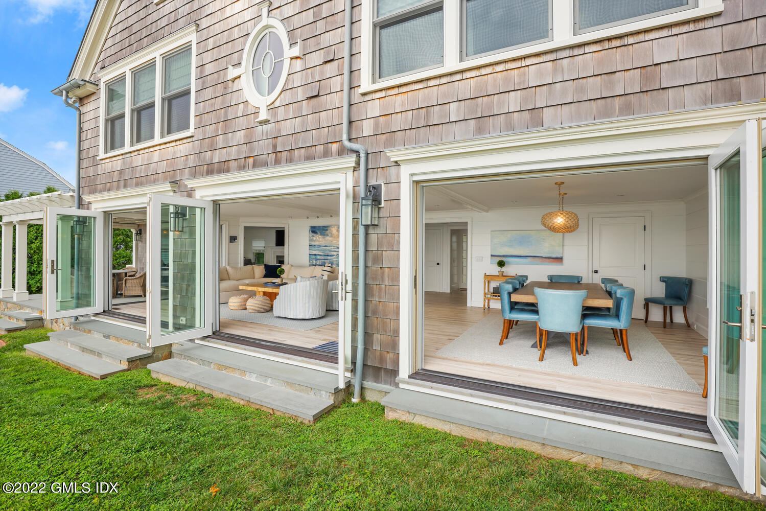 53 Shore Road Clinton, CT 06413 - Photo 14 of 32 a view of a house with a backyard porch and sitting area