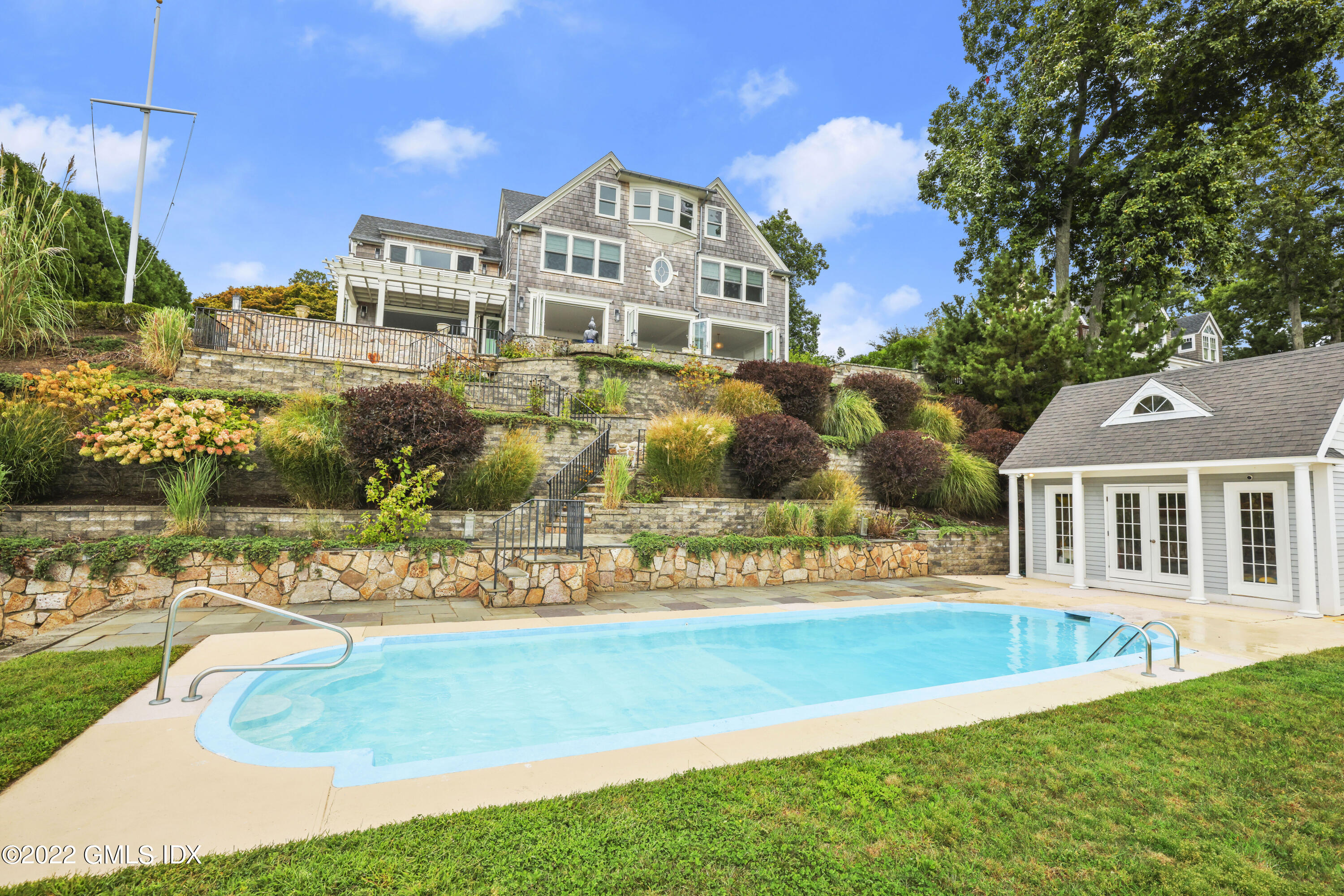 53 Shore Road Clinton, CT 06413 - Photo 22 of 32 a front view of a house with a yard