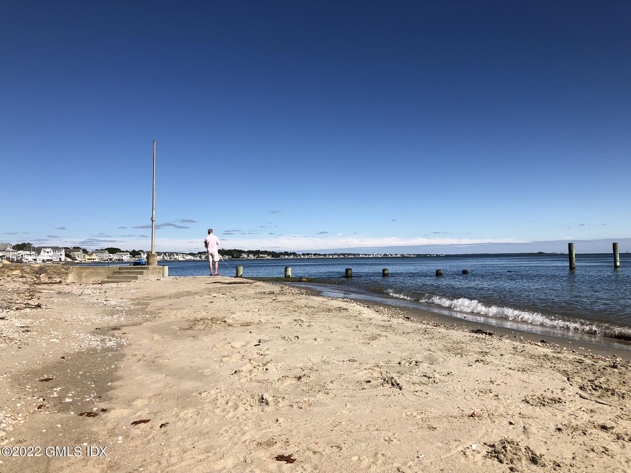 53 Shore Road Clinton, CT 06413 - Photo 32 of 32 a view of a dry yard with wooden fence
