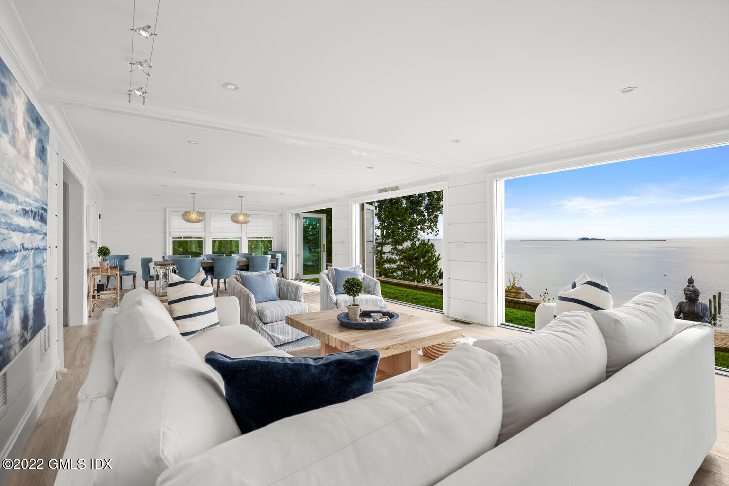 53 Shore Road Clinton, CT 06413 - Photo 4 of 32 a living room with furniture and a large window