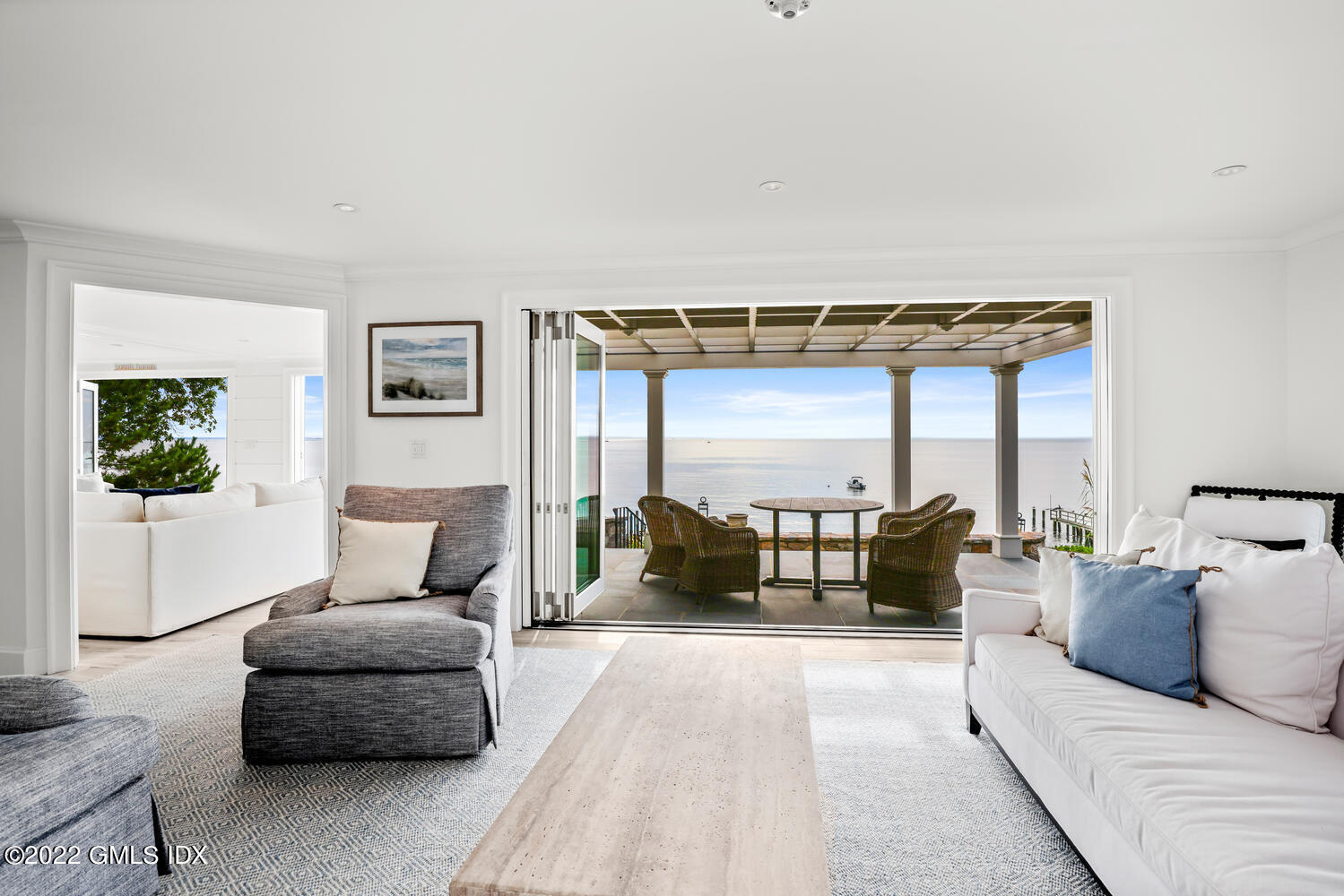 53 Shore Road Clinton, CT 06413 - Photo 5 of 32 a bedroom with furniture and a couch