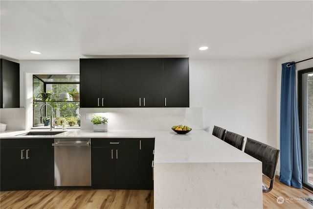 a kitchen with a sink and cabinets