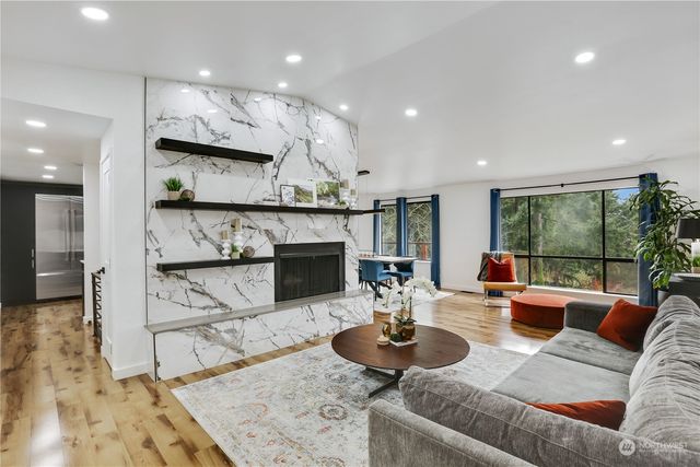 a living room with furniture and a table