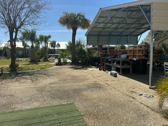a house view with swimming pool in front of it