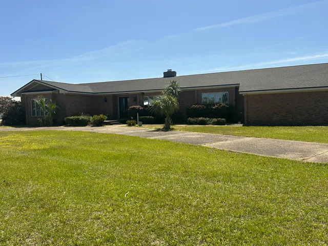 a view of a swimming pool and an outdoor space