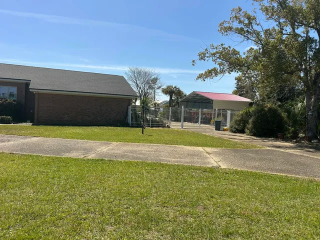 a room with a ceiling fan and a chandelier fan
