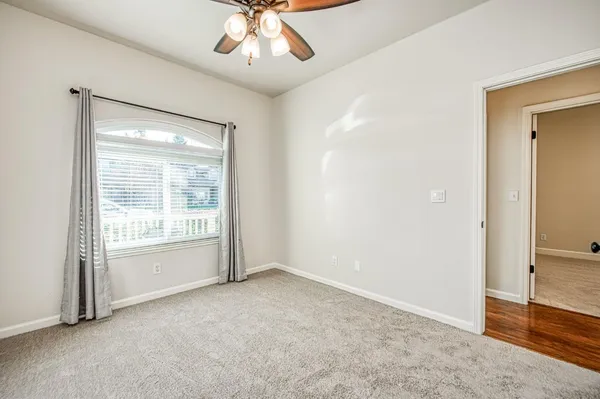 a bedroom with bed and window
