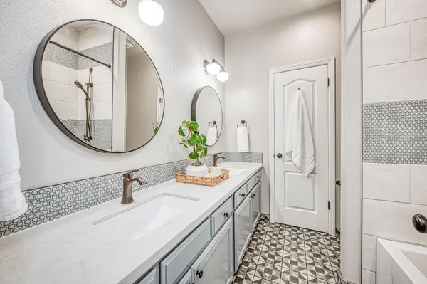 a spacious bathroom with a shower and a sink