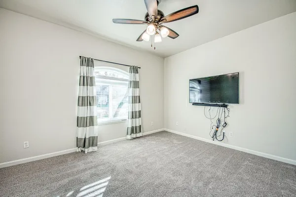 a view of kitchen with refrigerator stove microwave and cabinets
