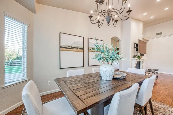a view of a dining room with furniture window and outside view